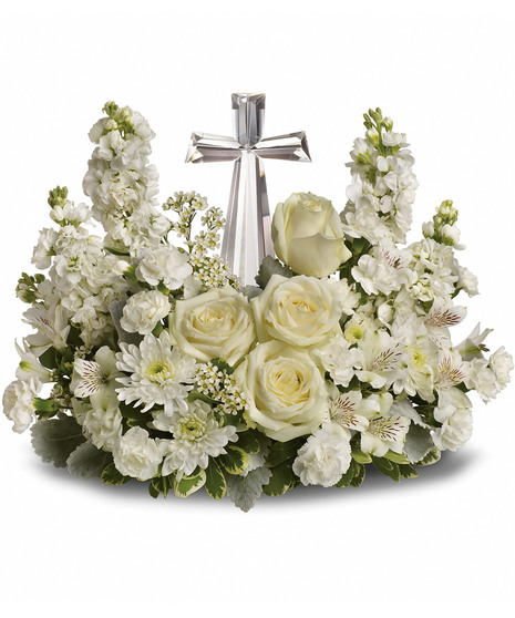 white floral arrangement accented with crystal cross