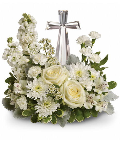 white floral arrangement accented with crystal cross