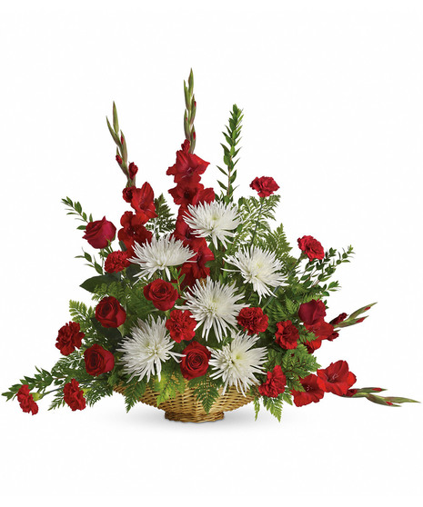 red and white floral arrangement in fireside basket