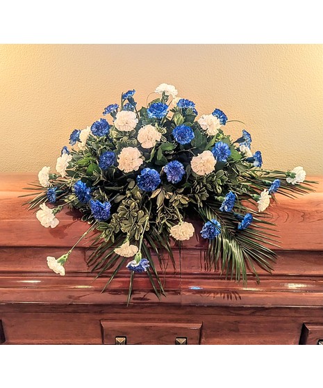 red carnation casket spray