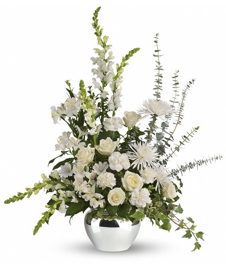 white flowers in silver jardiniere vase