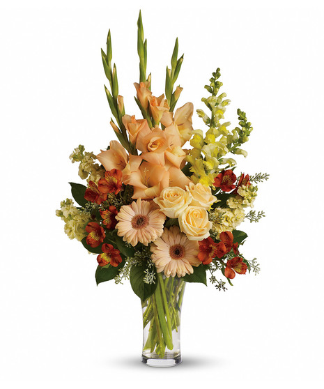 sunset-toned, tall flower arrangement