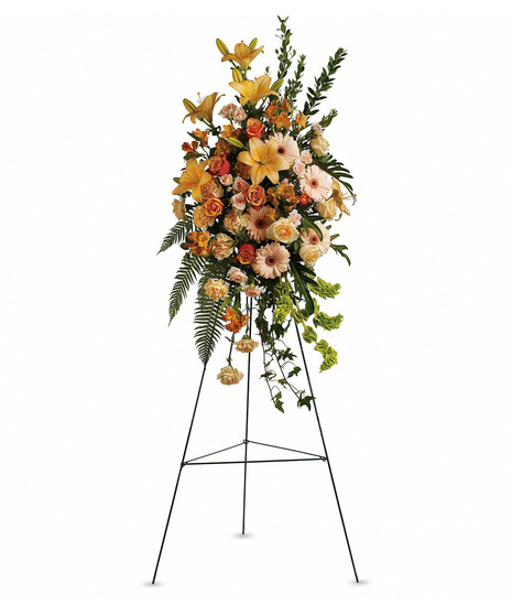 pastel oranges and yellow flowers in standing spray