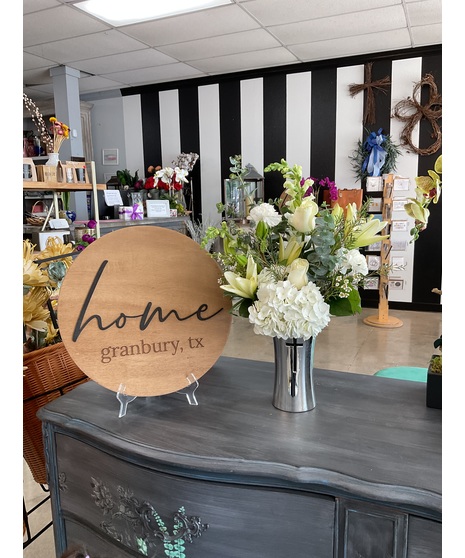 white floral arrangement accented with crystal cross