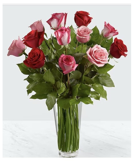 romantic long stem roses in reds, pinks, and lavender
